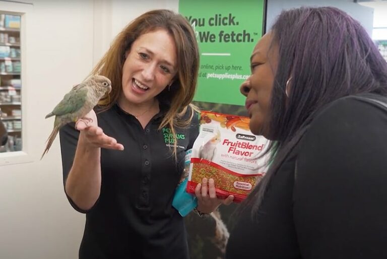 Franchise Owner Lori Nebel with a Pet Supplies Plus customer