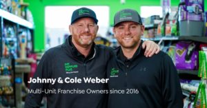 Johnny and Cole Weber, Multi-Unit Franchise owners since 2016, posing for a photo